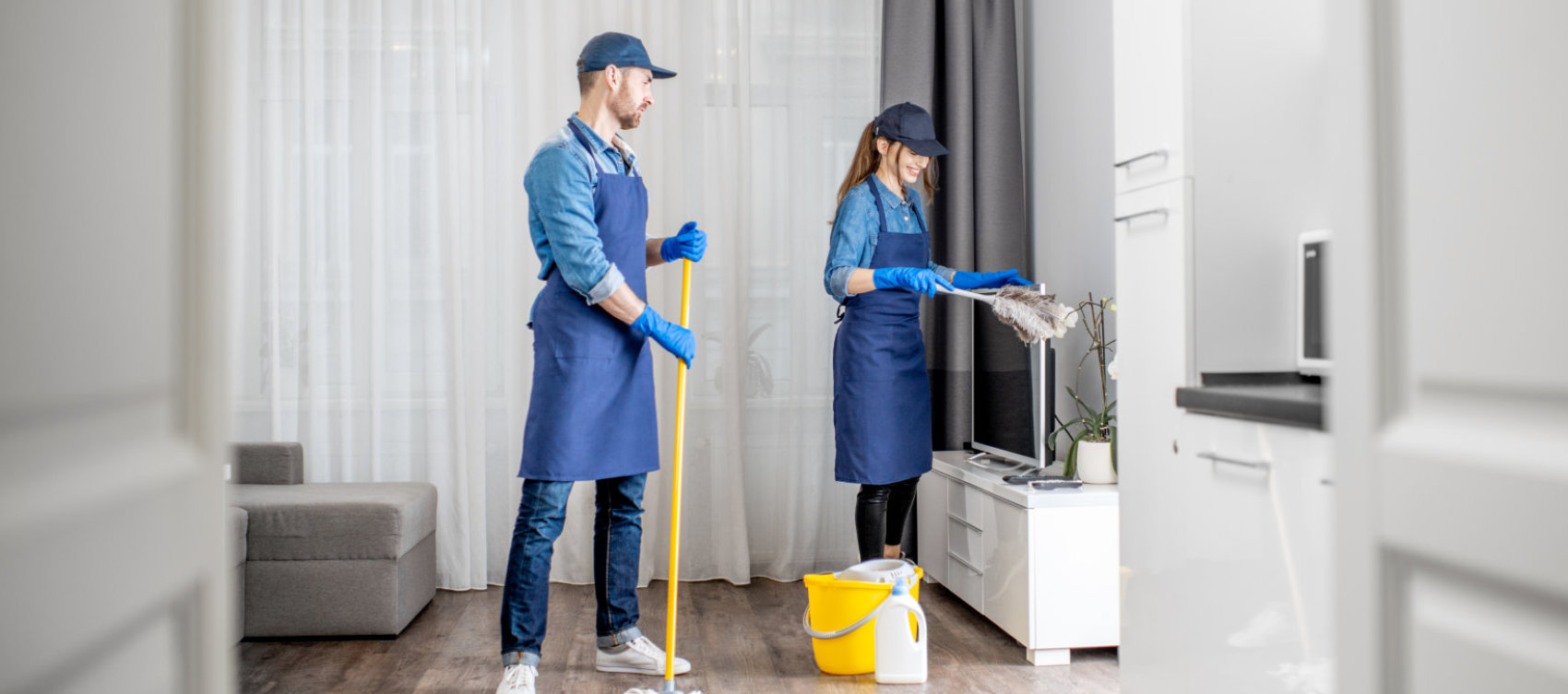 man and woman cleaning the room