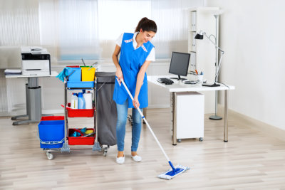 professional cleaner mopping the floor